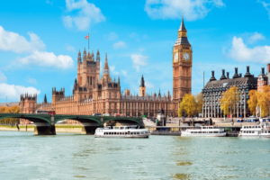 Big Ben clock tower in London with a clear blue sky background